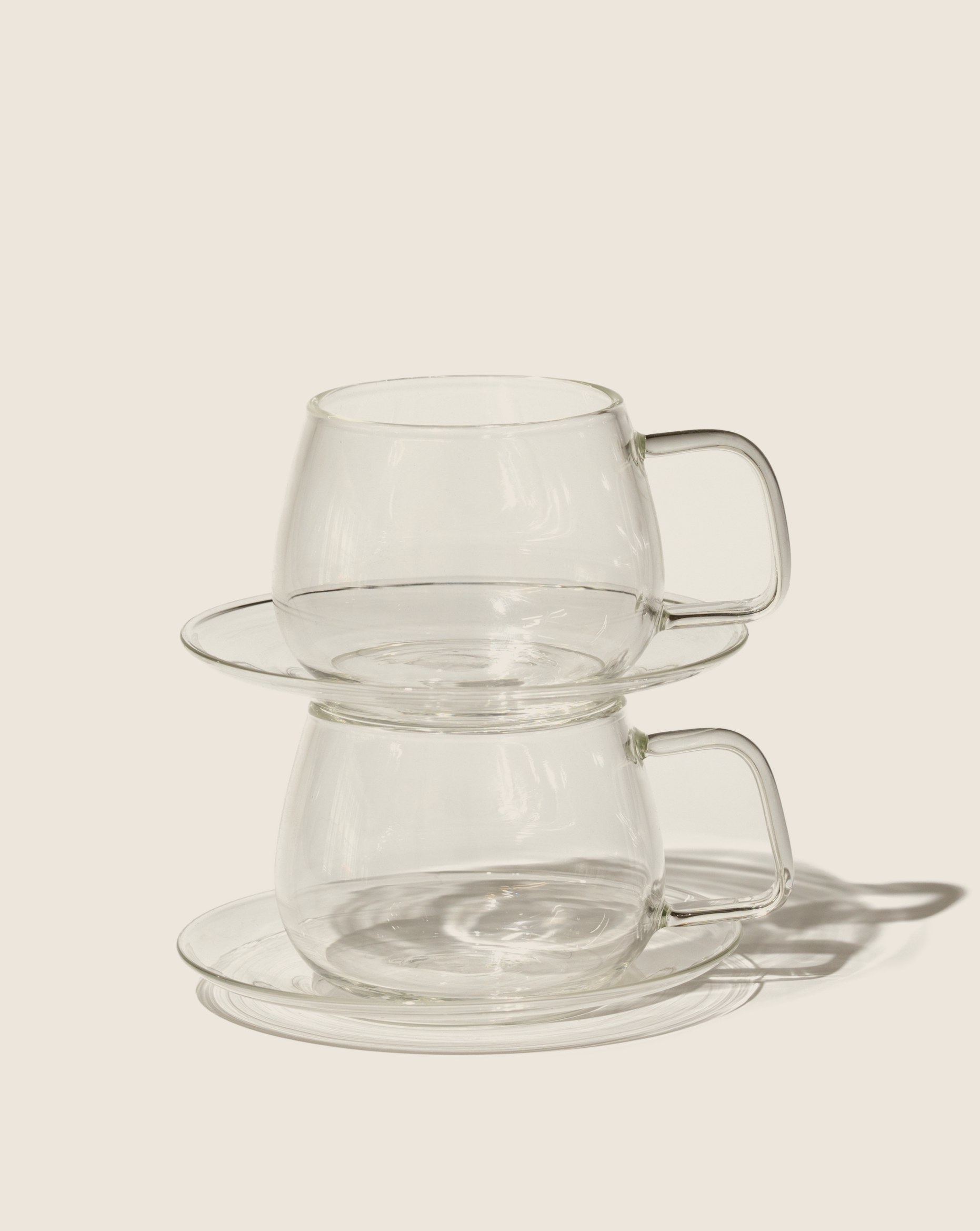 Glass cups & saucers (2)